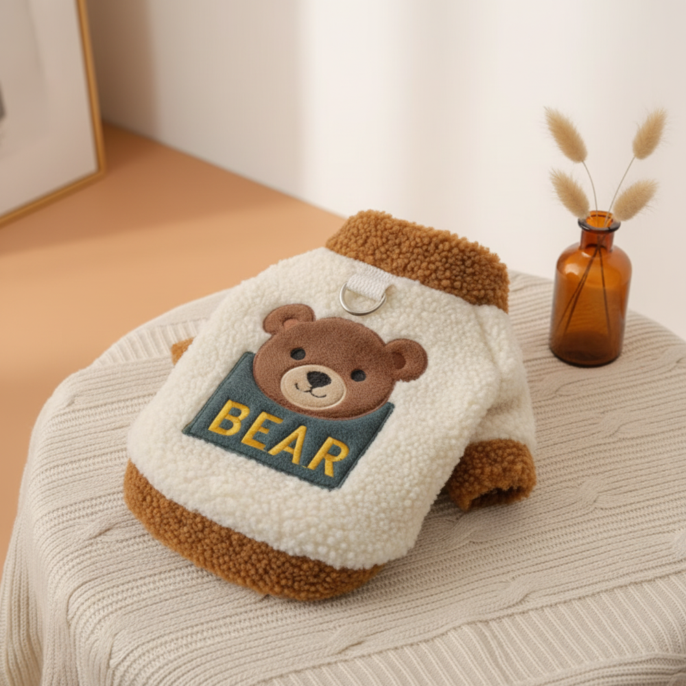 BEARVEE small pet winter essential, a soft and warm garment, displayed against a subtle gradient background of warm amber and